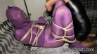 Jenny In Purple Pantyhose Encasement Bondaged With Ropes By Dominant Transvestite